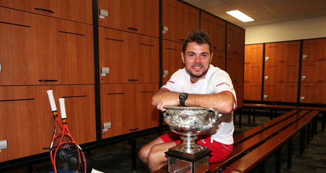 Stanislas Wawrinka: Swiss poses with the Australian Open trophy in the locker room at Melbourne Park