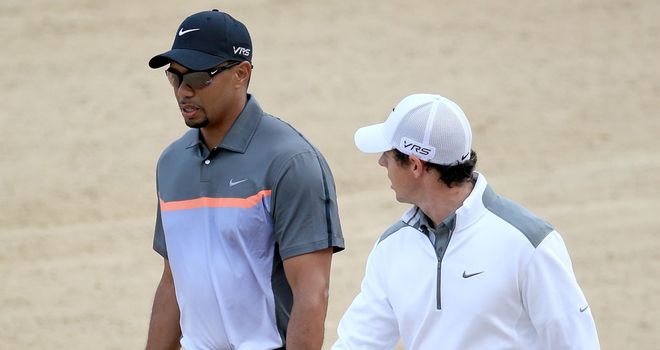 Rory McIlroy (R) outshone Tiger Woods on the opening day in Dubai