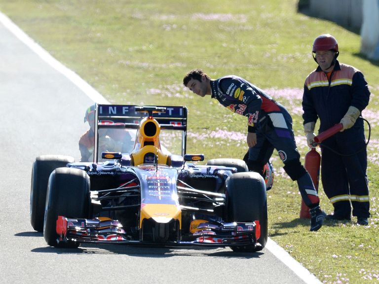 Smoke comes from the broken down Red Bull of Daniel Ricciardo