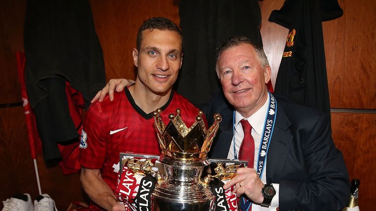 Vidic poses with Sir Alex Ferguson and the Premier League trophy