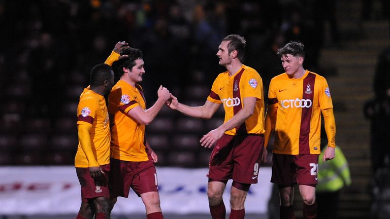Carl McHugh: Celebrates Bradford's winner
