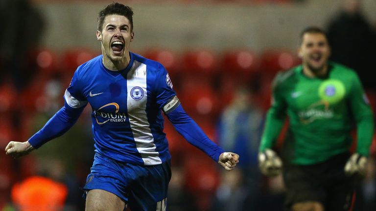 Tommy Rowe: Celebrates after slotting in the winning penalty