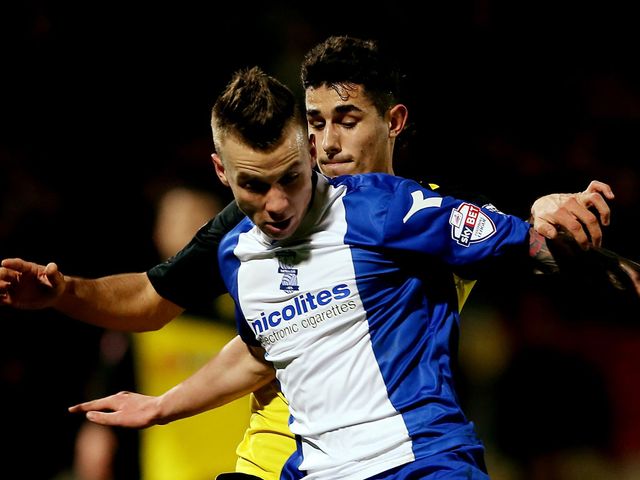 Albert Rusnak of Birmingham holds off Davide Faraoni