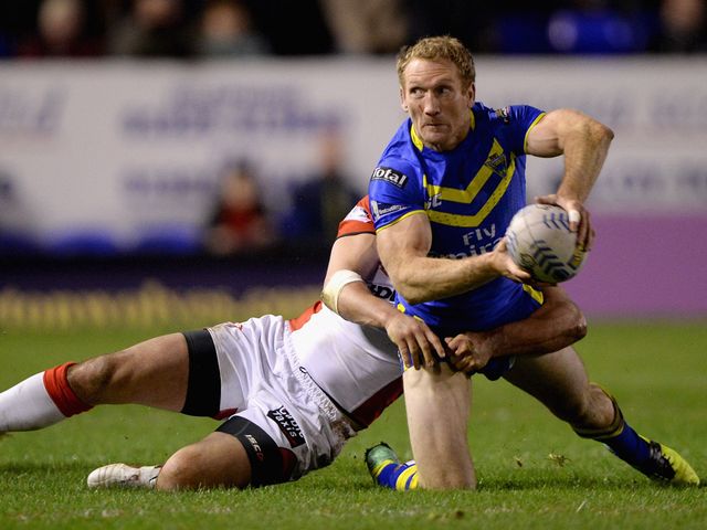 Michael Monaghan tries an offload under pressure