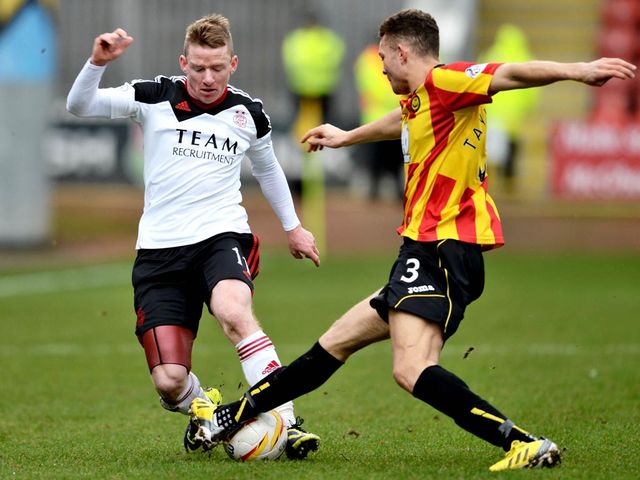 Aaron Taylor-Sinclair challenges Jonny Hayes