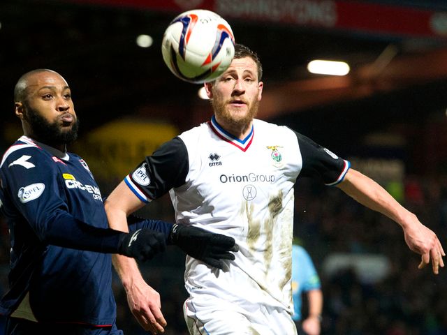 Yoann Arquin and Gary Warren battle for possession