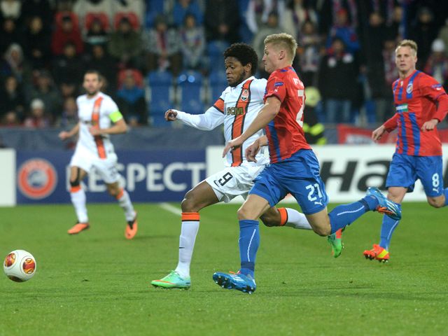 Vaclav Prochazka of Plzen vies for a ball with Luiz Adriano Shakhtar