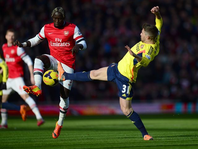 Bacary Sagna of vies with Fabio Borini