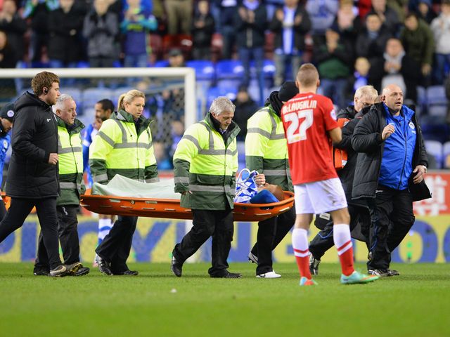 Ben Watson of Wigan is taken off injured