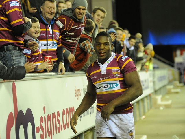 Jermaine McGillvary celebrates with the Huddersfield fans