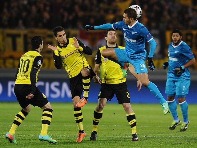 Viktor Fayzulin jumps for the ball