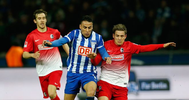 Anis Ben-Hatira and Oliver Sorg compete
