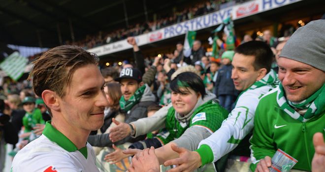 Goalscorer Ludovic Obraniak celebrates with Werder Bremen fans