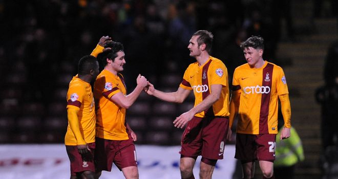 Carl McHugh: Celebrates Bradford's winner