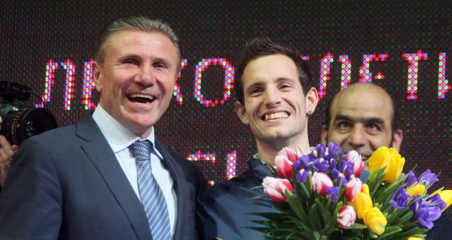 Sergey Bubka (left) congratulates Renaud Lavillenie on breaking his indoor pole vault world record
