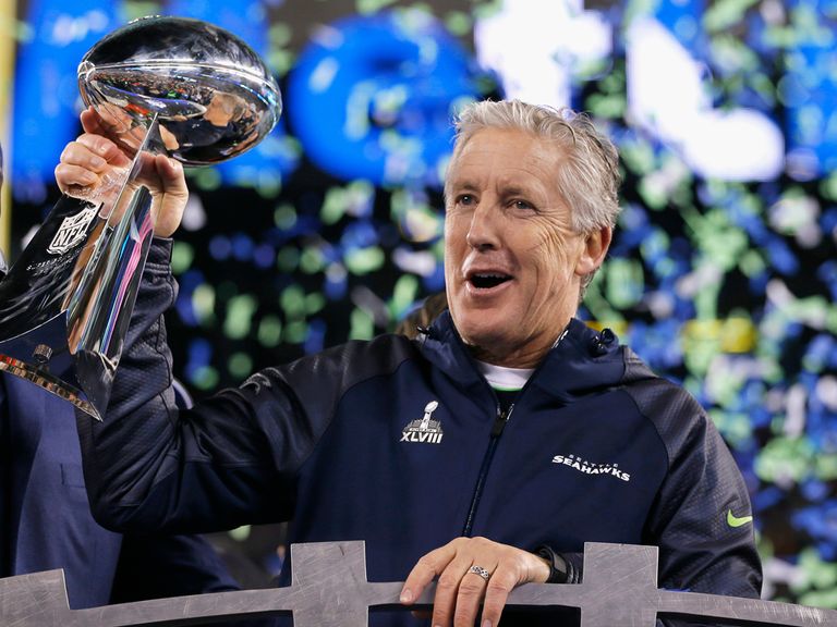 Seattle head coach Pete Carroll lifts the Lombardi Trophy