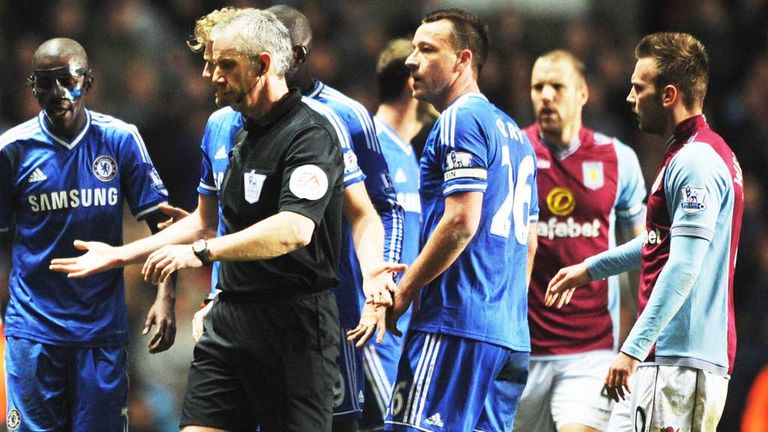 Referee Chris Foy had a busy evening officiating Aston Villa and Chelsea