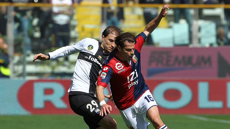 Emanuele Calaio is challenged by Gabriel Paletta