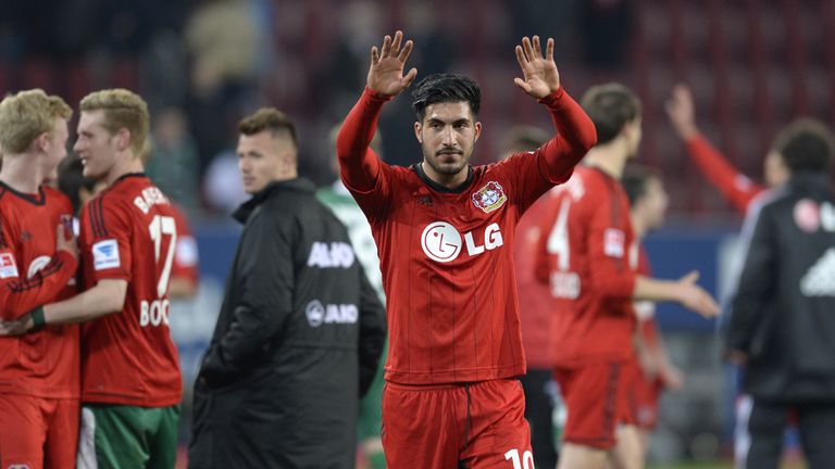 Leverkusen's midfielder Emre Can celebrates at full time
