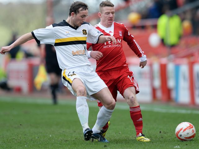 Dumbarton's Chris Kane and Jonny Hayes go for the ball