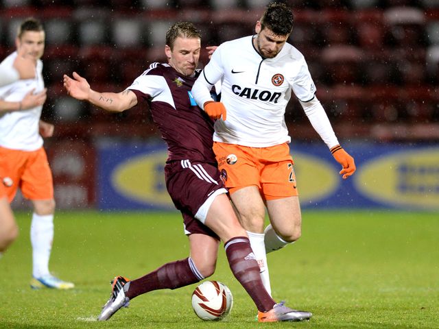 Ryan Stevenson makes a challenge on Nadir Ciftci