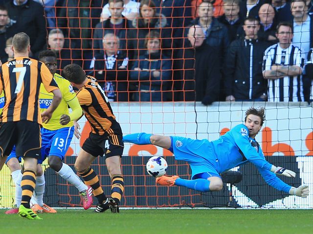 Tim Krul makes a save from Alex Bruce