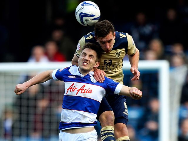 Jason Pearce towers above Kevin Doyle to win a header