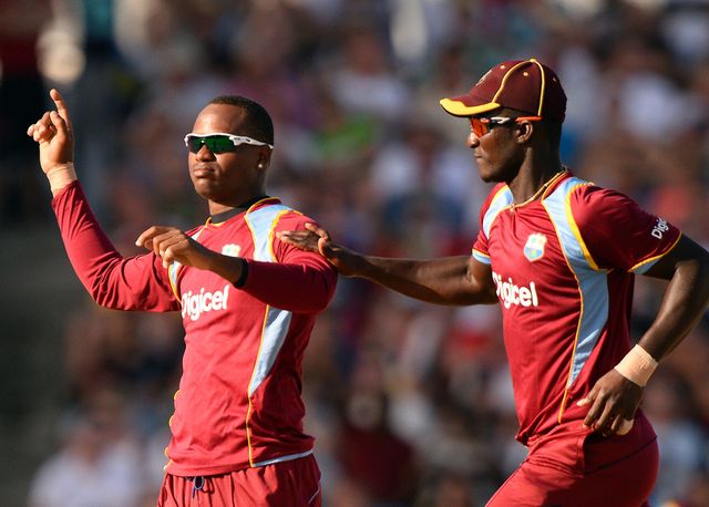 Marlon Samuels and Darren Sammy after taking Eoin Morgan's wicket