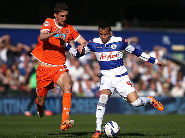 Chris Basham and Ravel Morrison battle for the ball