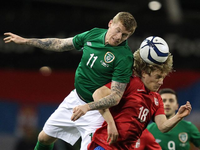 James McClean goes up for a header