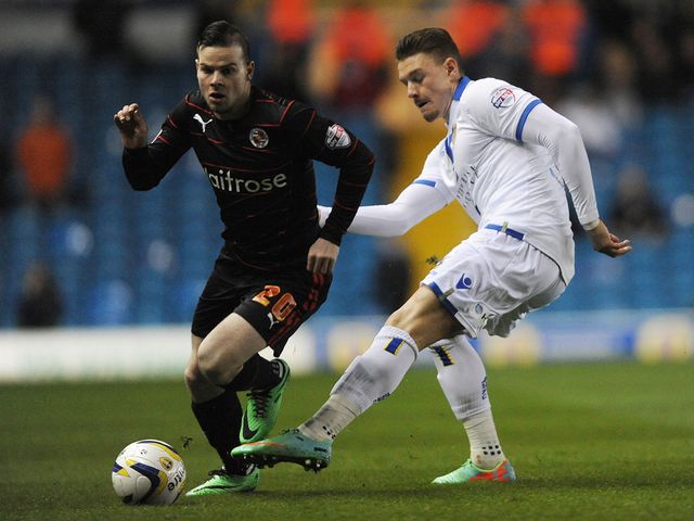 Danny Guthrie and Connor Wickham in action