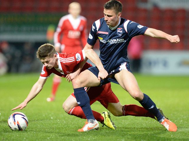 Aberdeen's Cammy Smith (left) is tackled by Filip Kiss