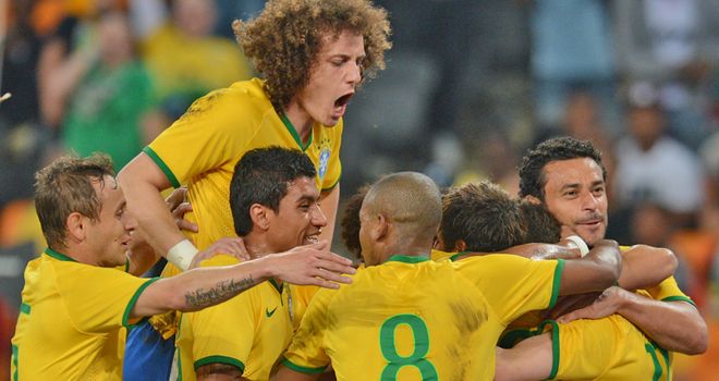 Neymar is mobbed after firing a treble against South Africa
