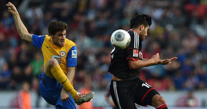 Benjamin Kessel and Emre Can vie for the ball
