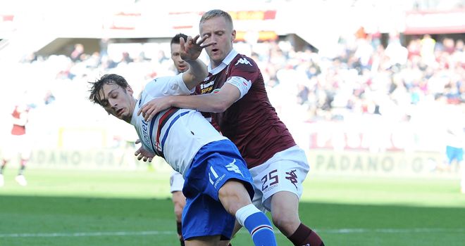 Manolo Gabbiadini is knocked over by Kamil Glik