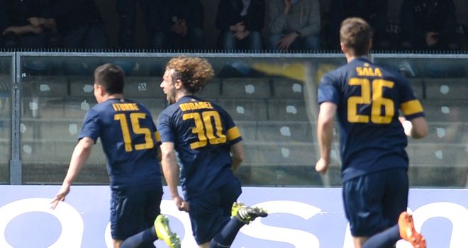 Marco Donadel of Verona celebrates after scoring