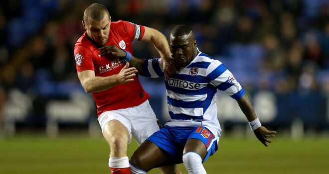 Goalscorer Dawson in action against Reading's Royston Drenthe