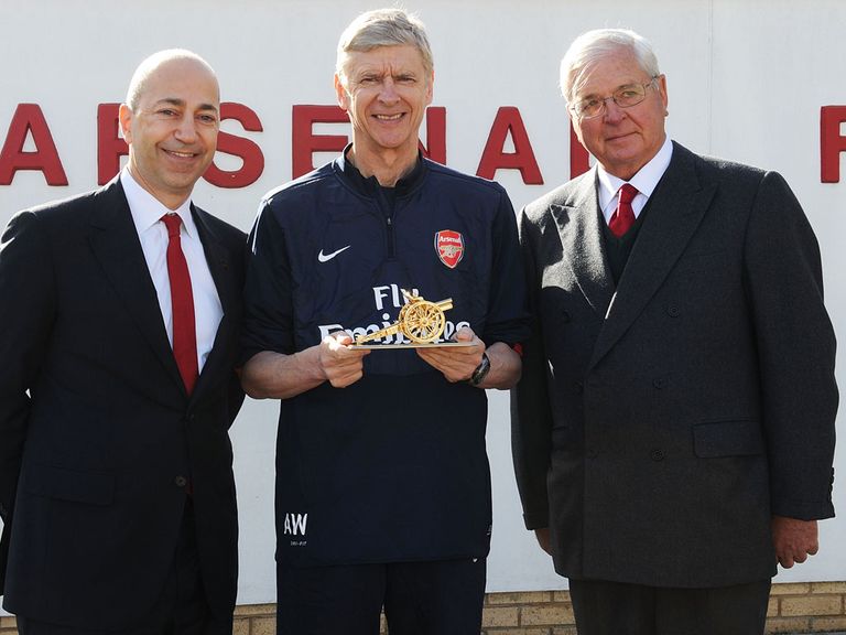 Arsene Wenger being presented with a gold cannon