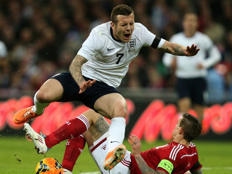 Jack Wilshere: Injured after this tackle by Daniel Agger