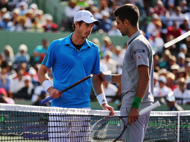 Murray (l) and Djokovic discuss the controversial first-set moment