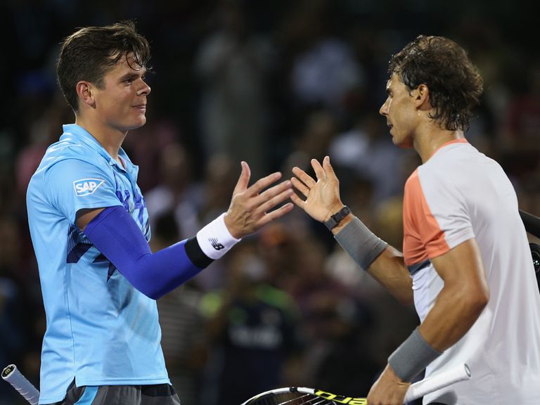 Rafael Nadal shakes hands with Milos Raonic