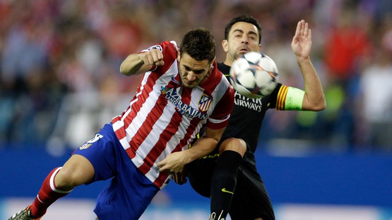 Battling for the ball with Xavi Hernandez in the Champions League win over Barcelona