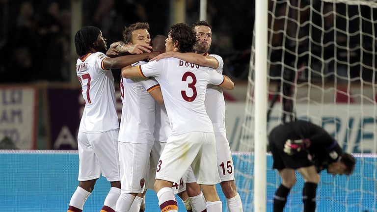 Roma players celebrate after the winning goal is scored