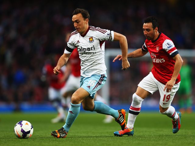 Mark Noble gets away from Santi Cazorla