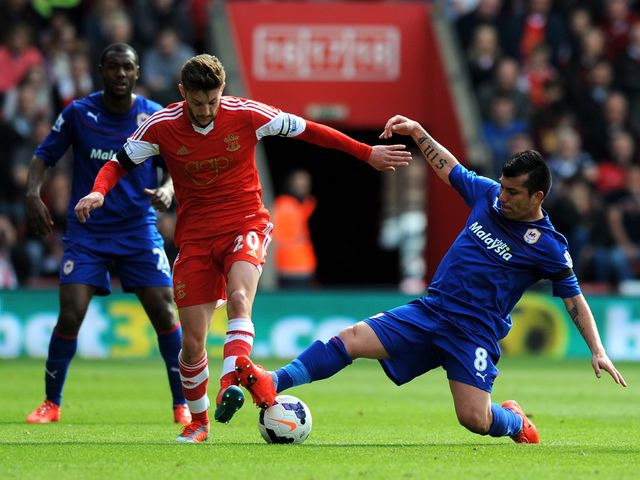 Adam Lallana avoids Gary Medel