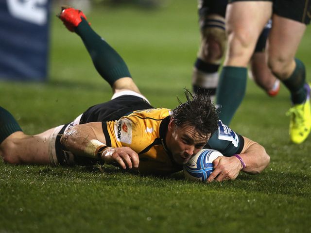 Ben Foden of Northampton dives over for a try