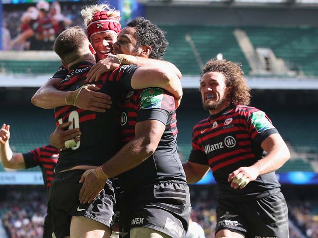 Owen Farrell celebrates after scoring Saracens' third try