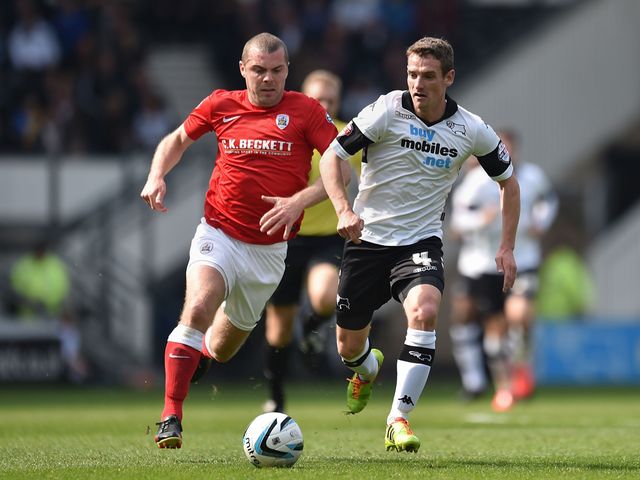 Derby County's Craig Bryson gets away from Barnsley's Stephen Dawson