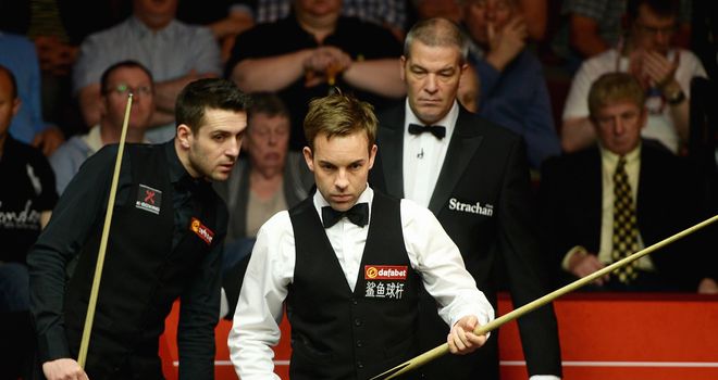 Ali Carter (right) playing Mark Selby at the World Championship last month