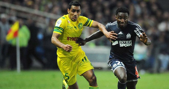 Banel Nicolita vies with Brice Dja Djedje